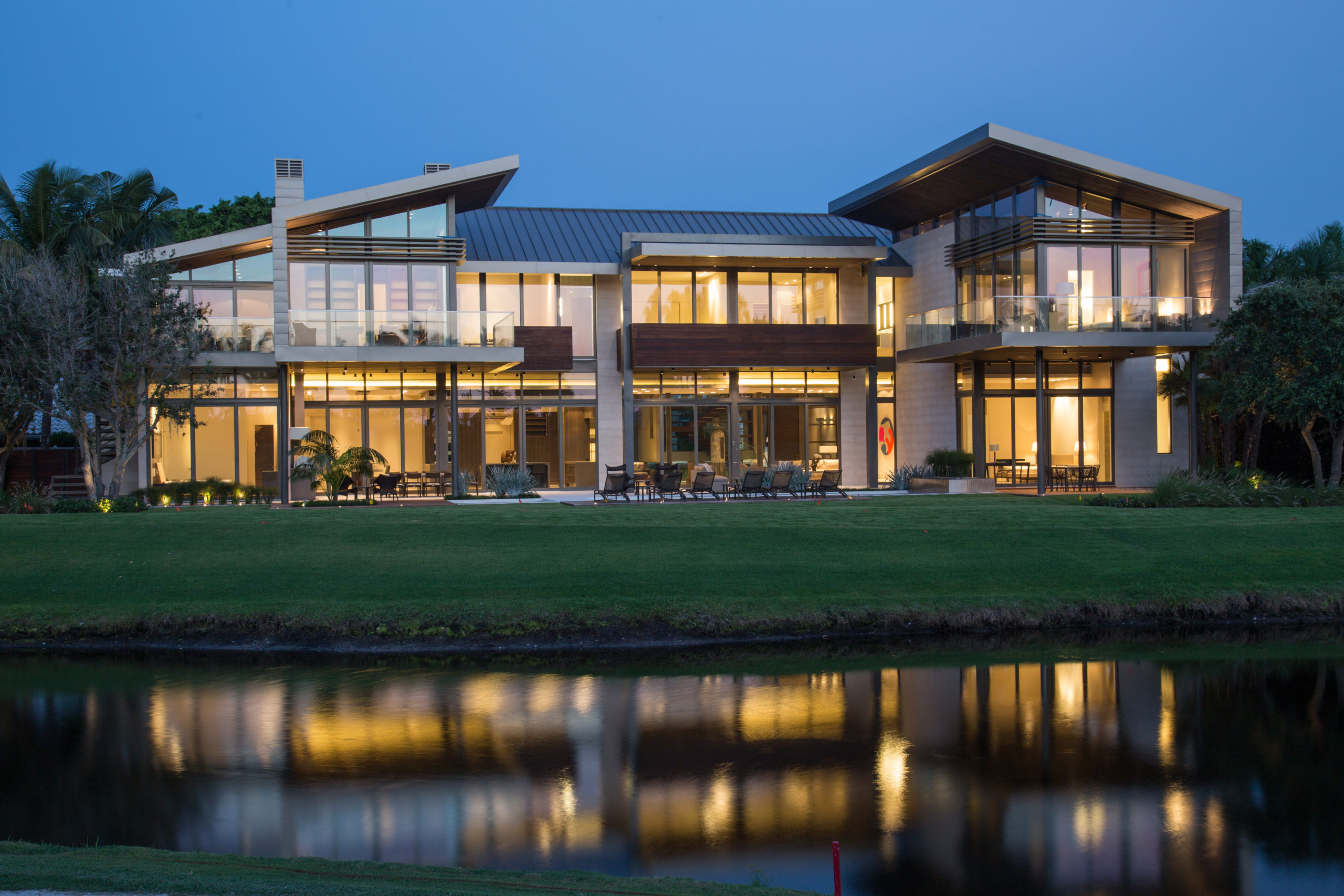 Contemporary home on lake reflection in water